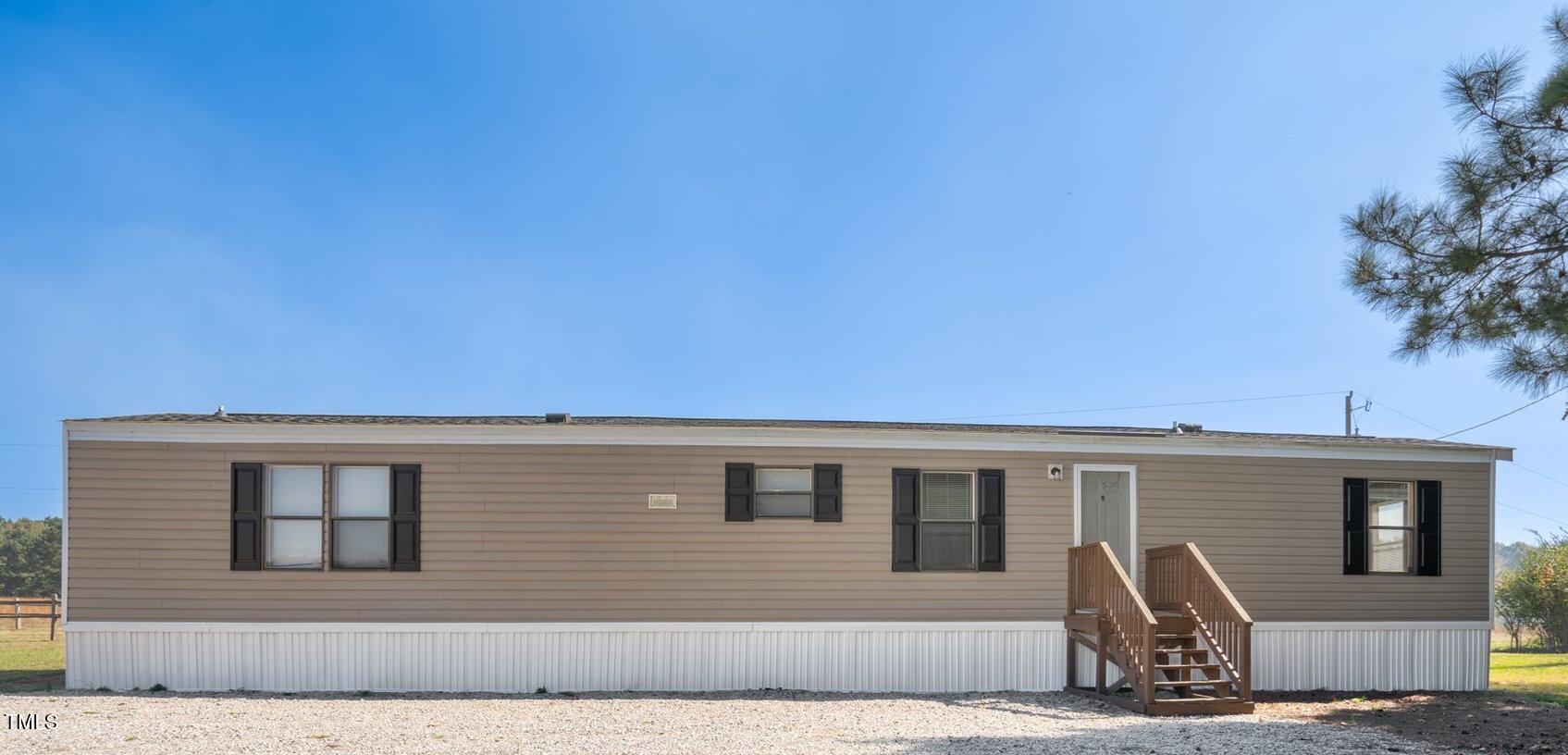 a front view of a house with garage