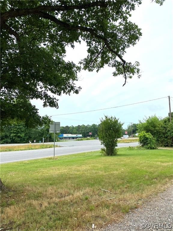 a view of a field with an trees