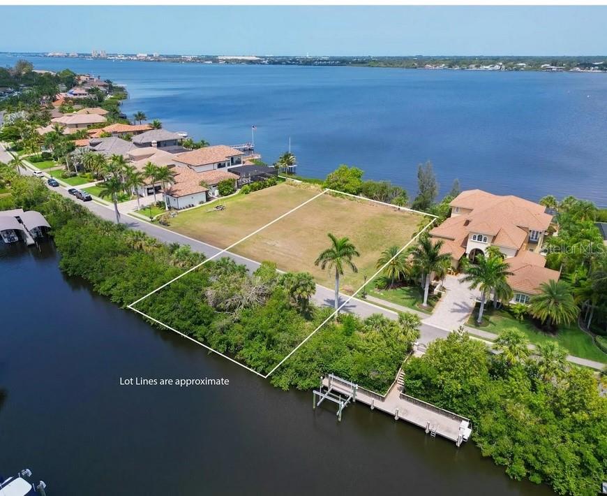 an aerial view of a house with a lake view