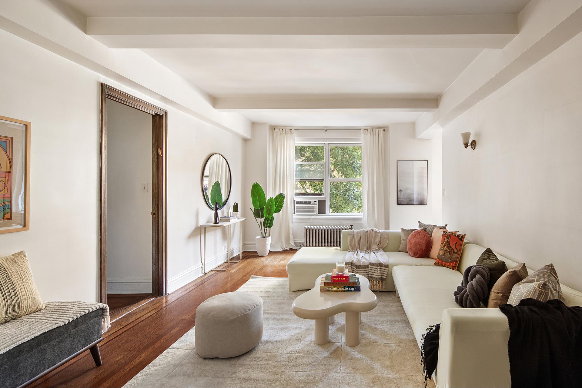 a living room with furniture and a wooden door