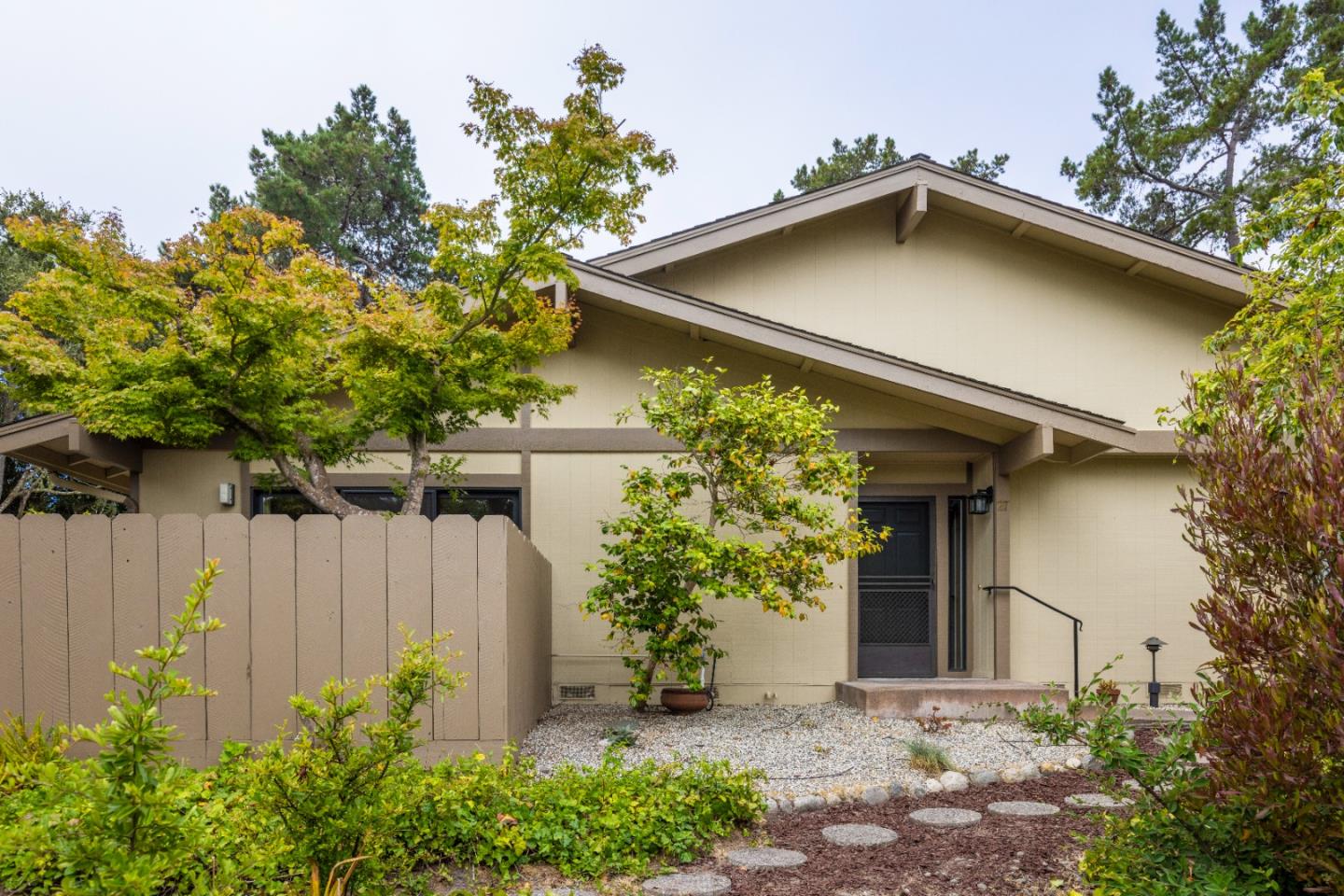 a house with a trees in front of it