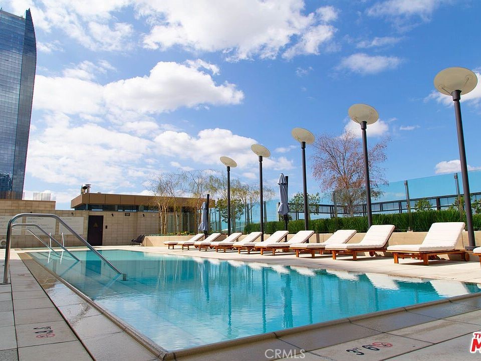 a view of swimming pool with seating space and seating space