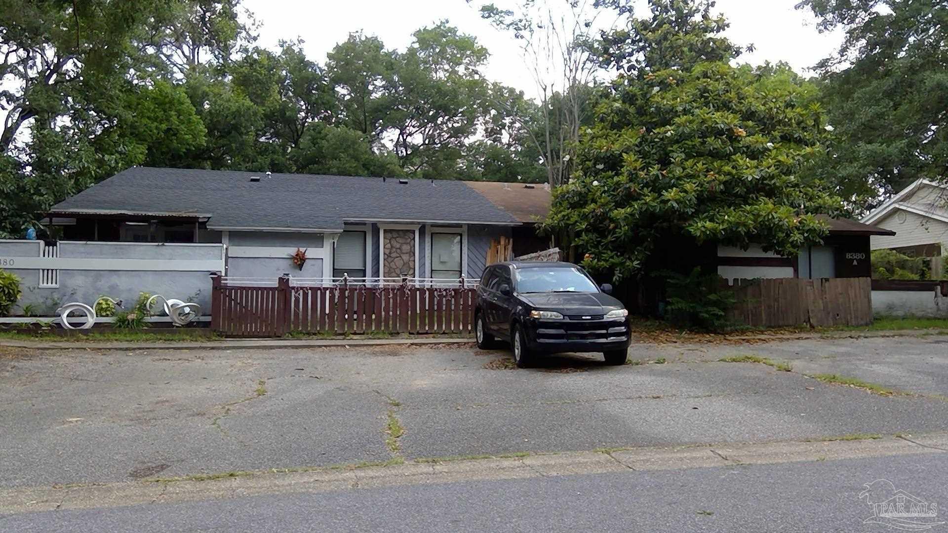 a car parked in front of a house