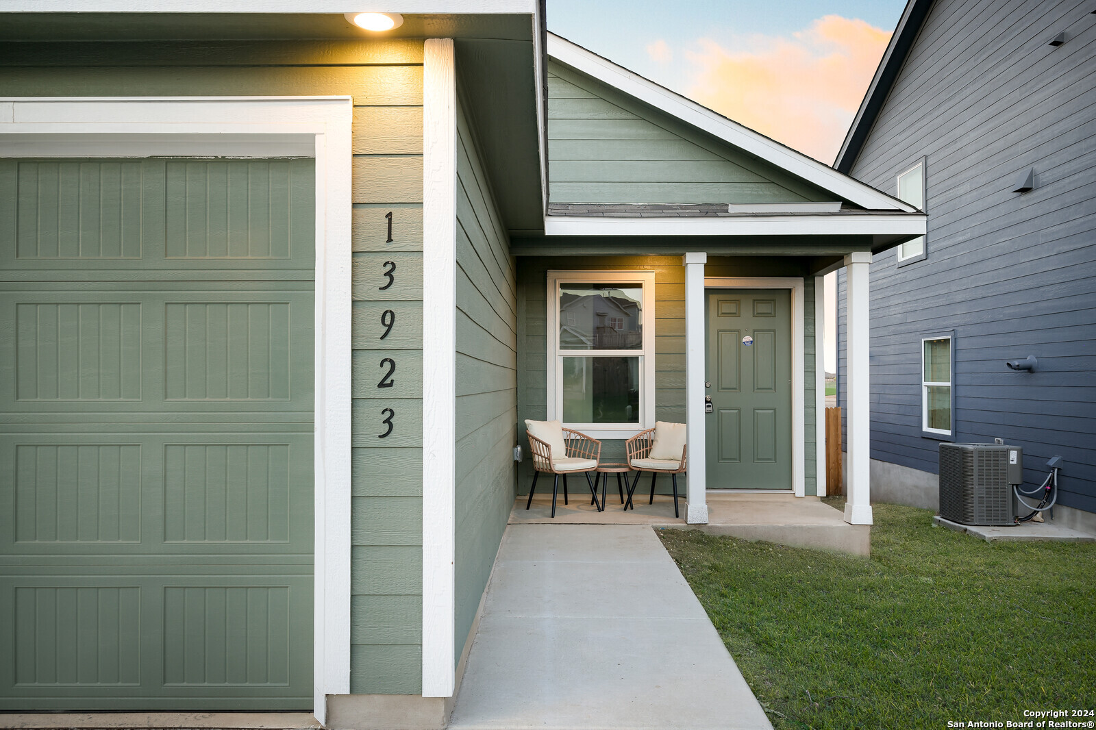 a front view of a house with outdoor seating yard