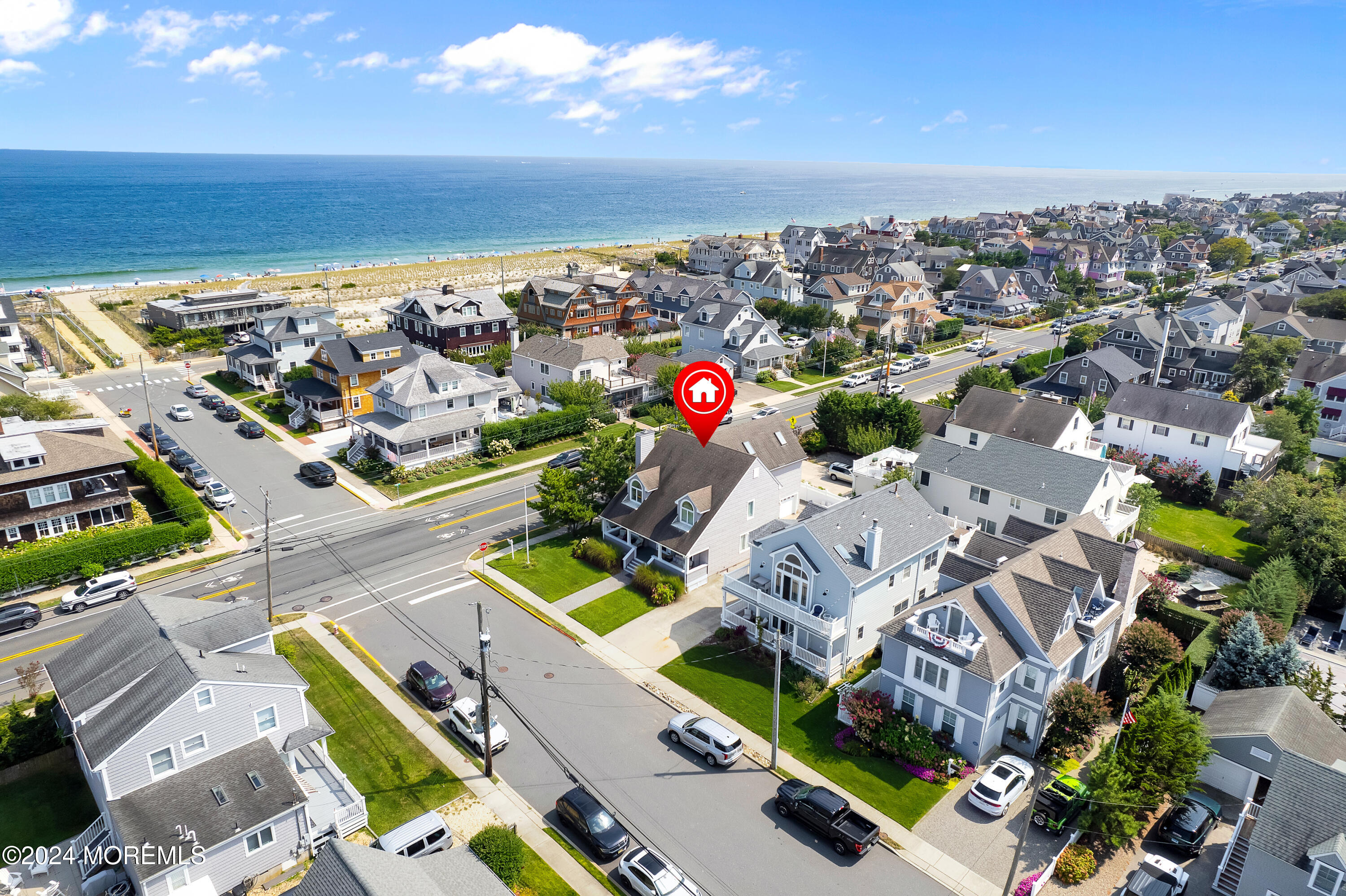 an aerial view of a house with a ocean view