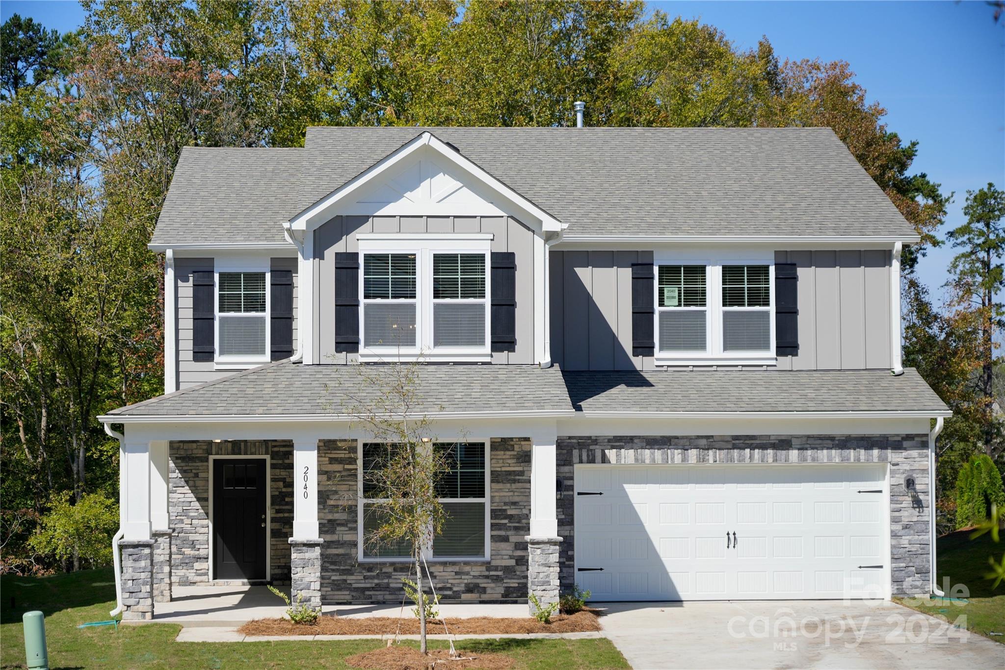 front view of a house with a yard