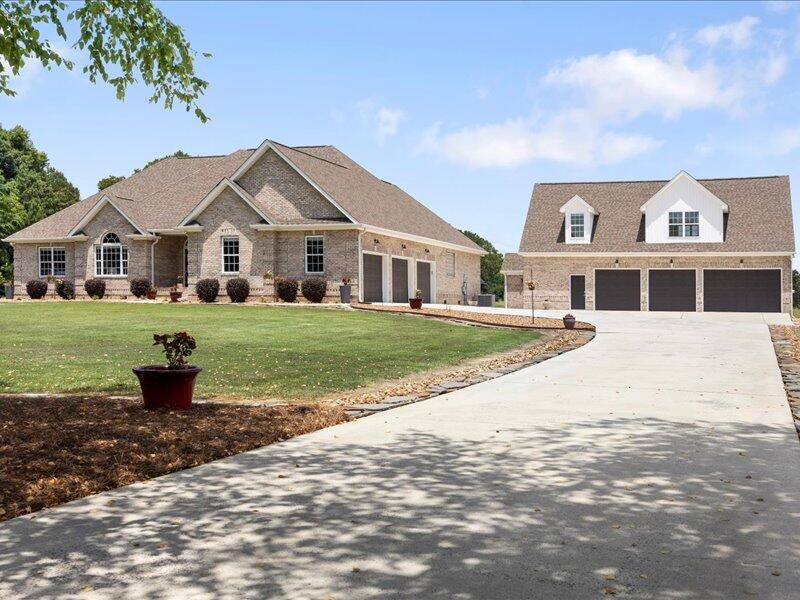 a front view of a house with a yard