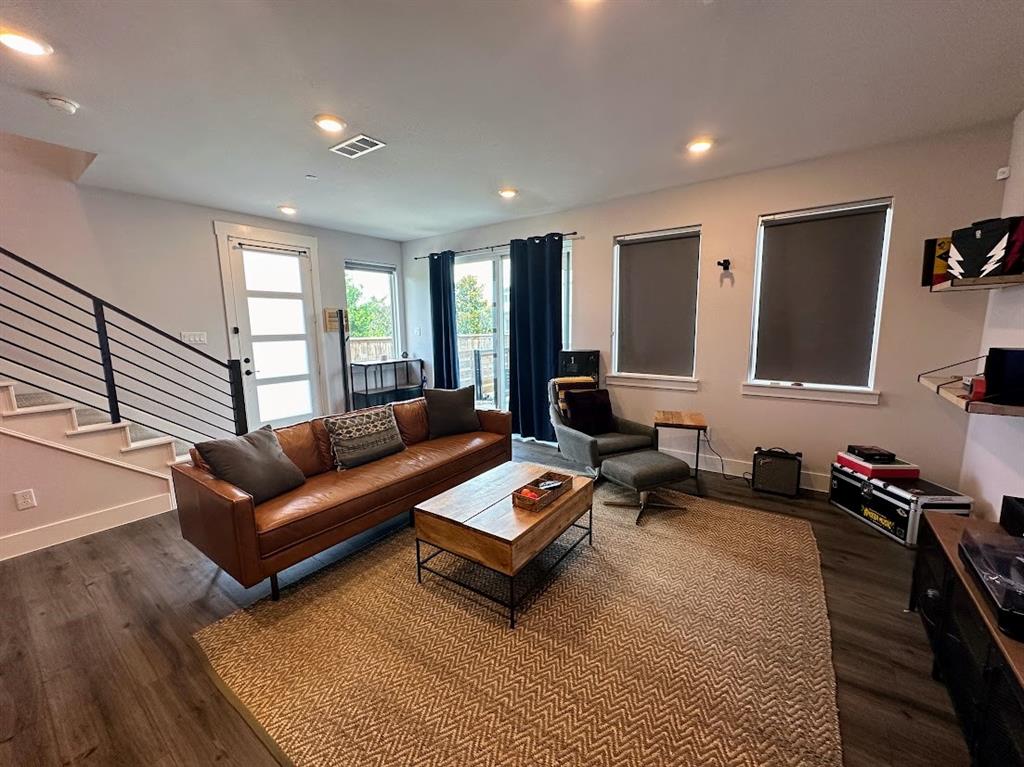 a living room with furniture rug and window