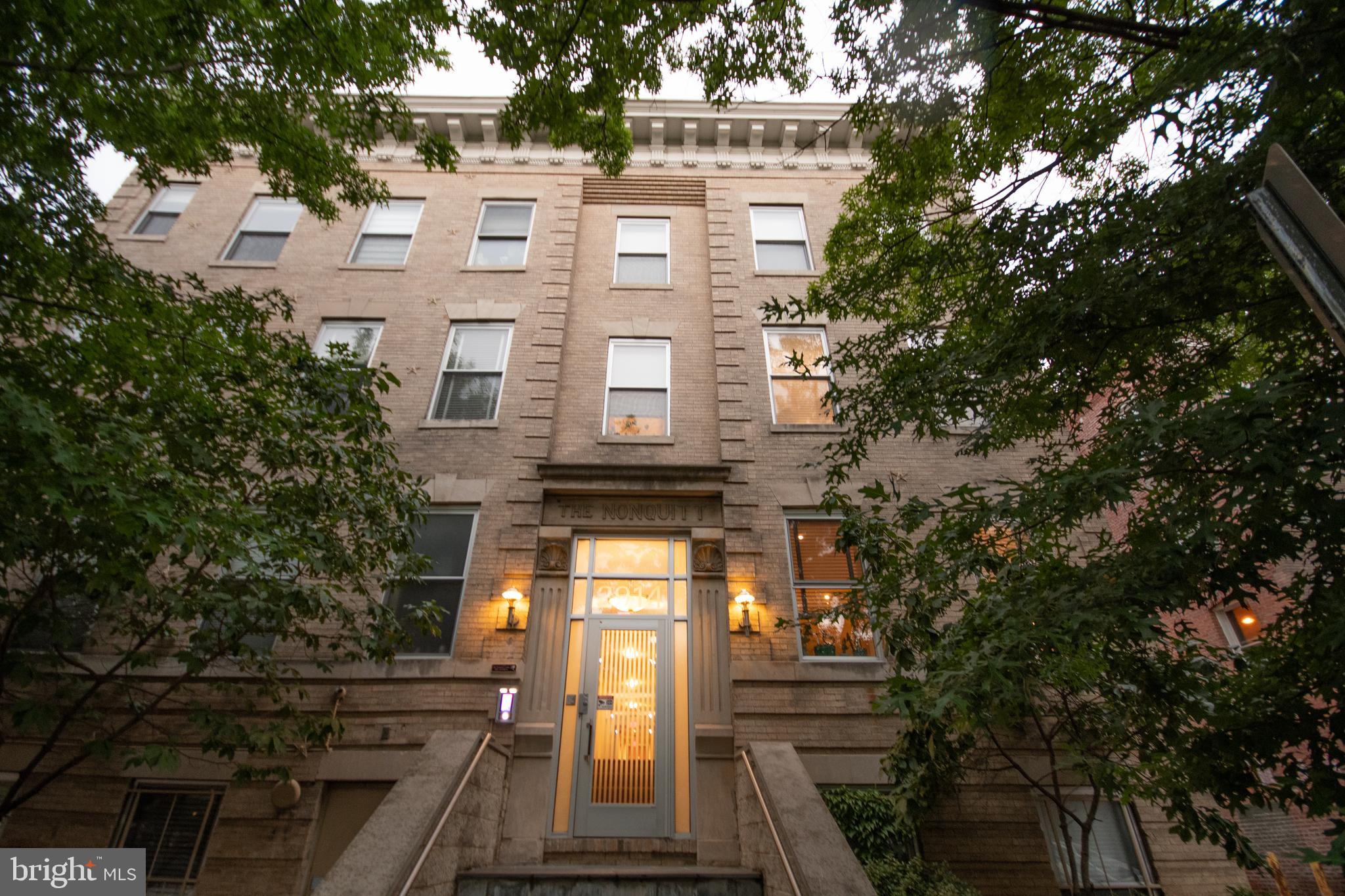 a view of a building with a tree