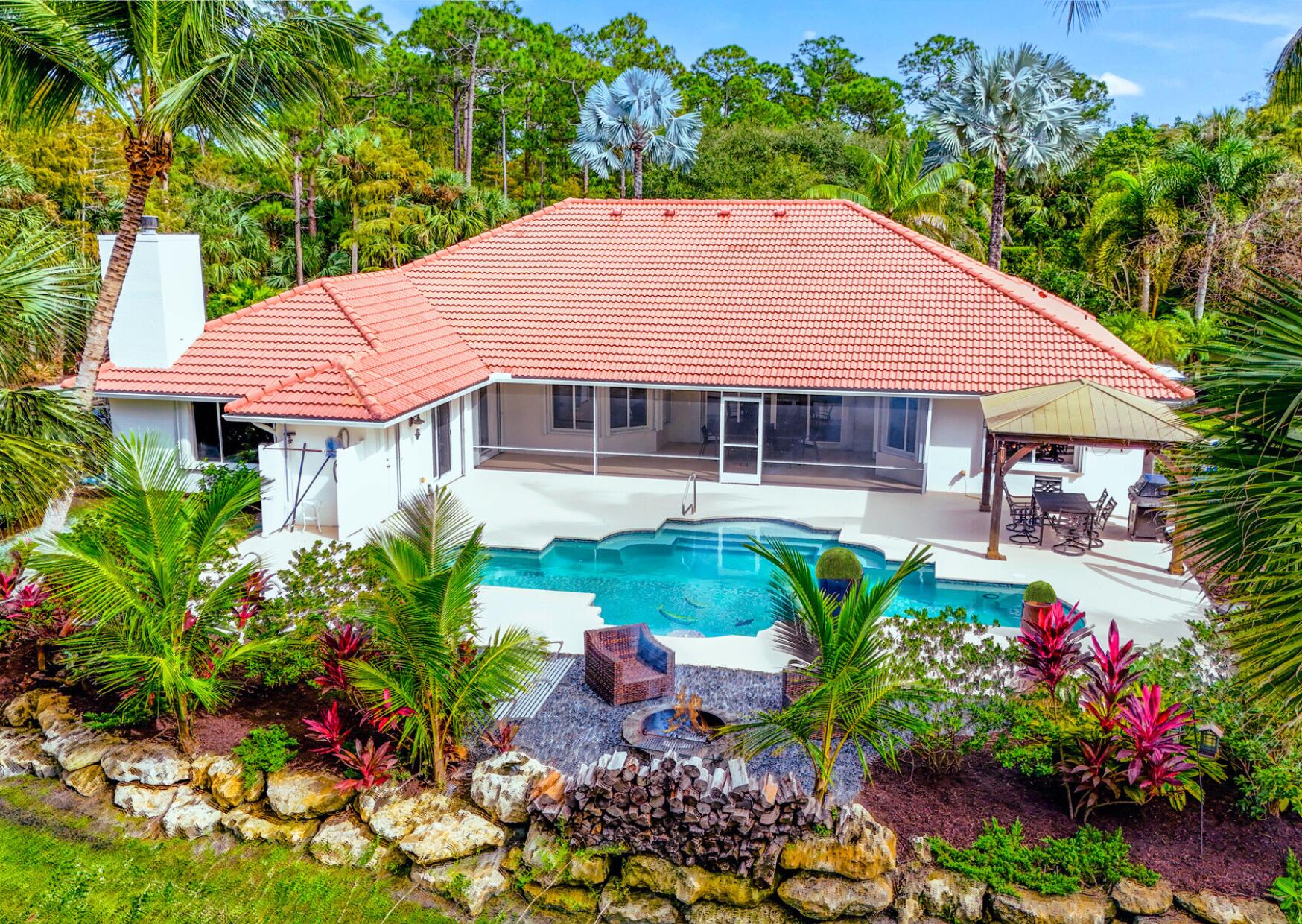 a view of a house with a yard and garden