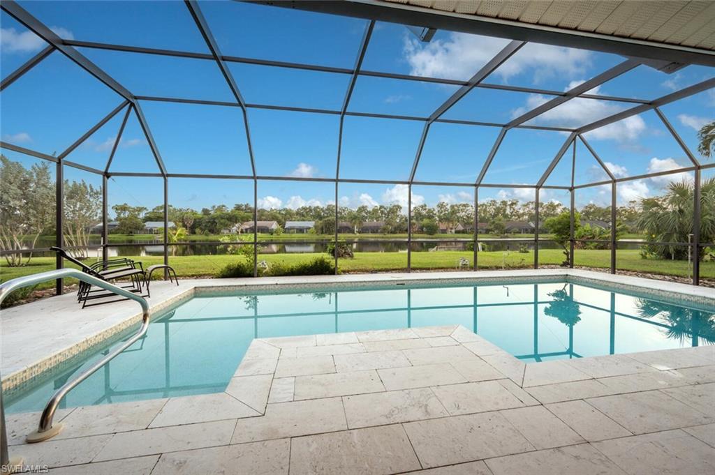 a view of a swimming pool with a lounge chair