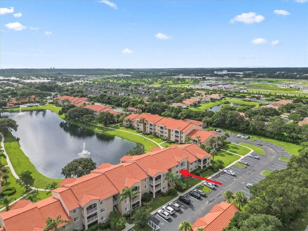 an aerial view of a city with lake view