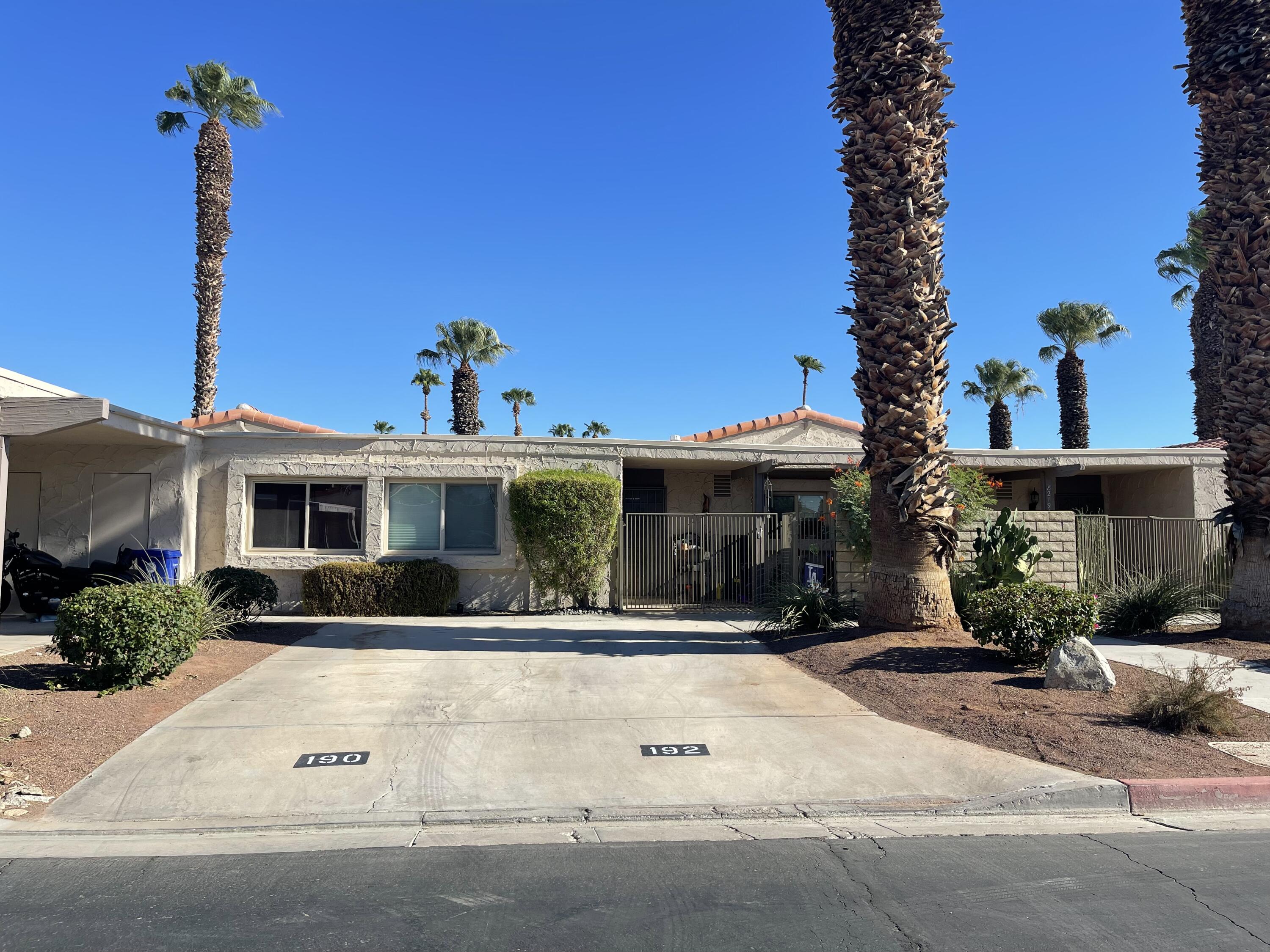 a front view of a house with yard