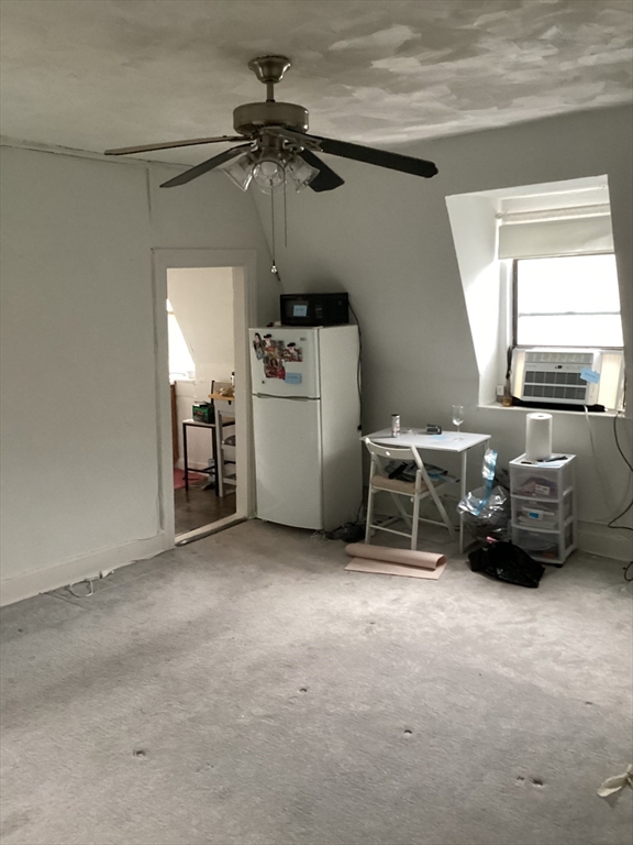 a view of livingroom with furniture and windows