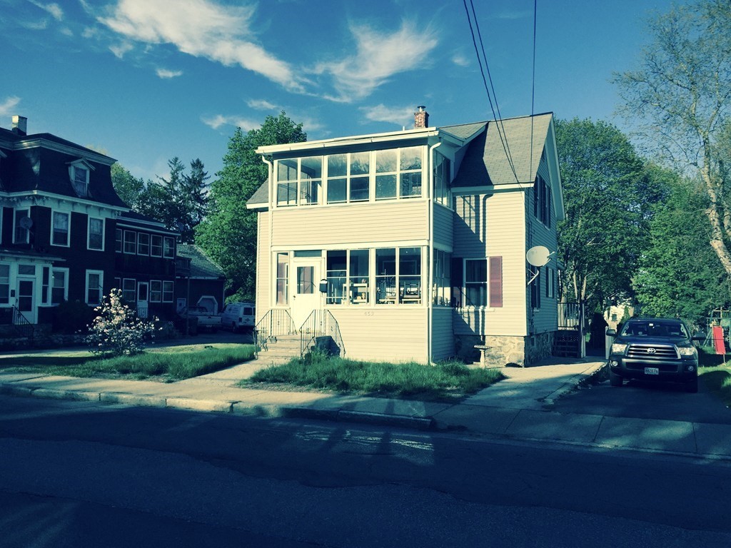 a view of a building with a yard