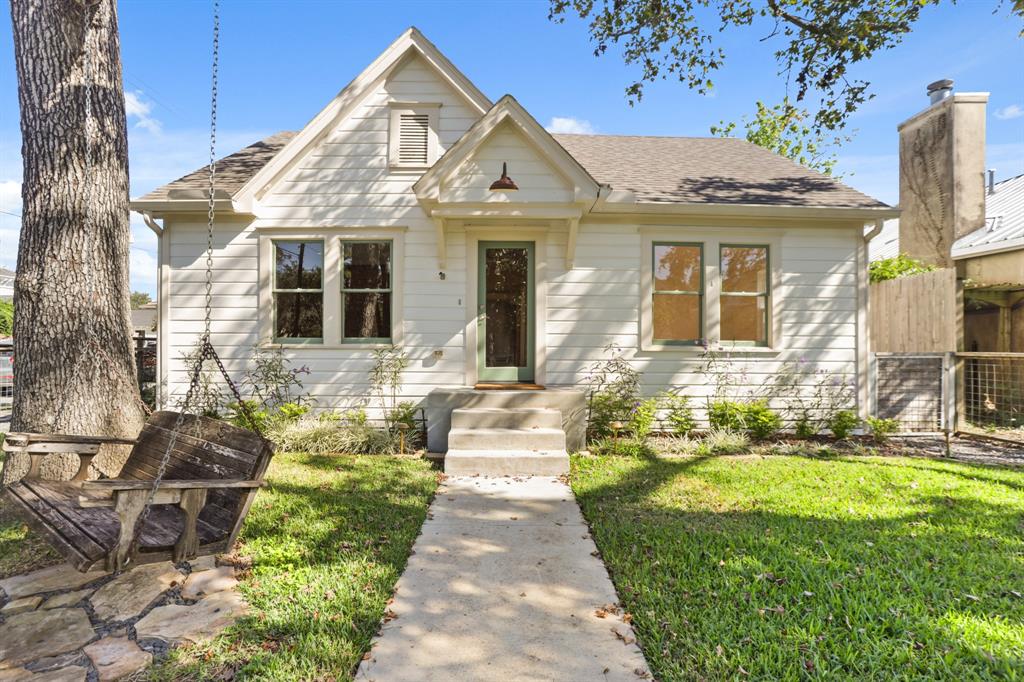 Beautiful shot of the front of the home, the original facade. Keep clicking to see this how this bungalow has been expanded!