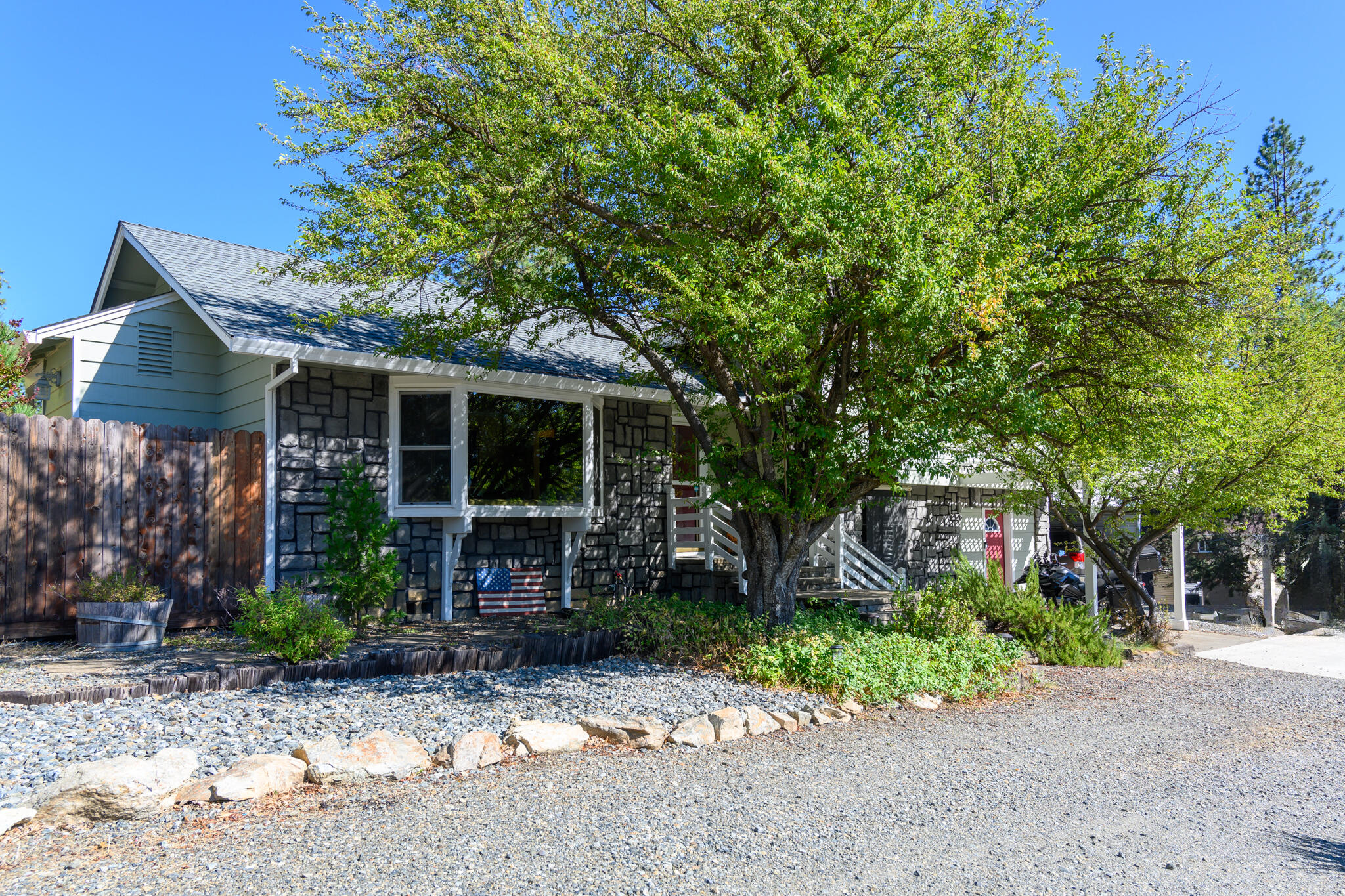 a front view of a house with garden