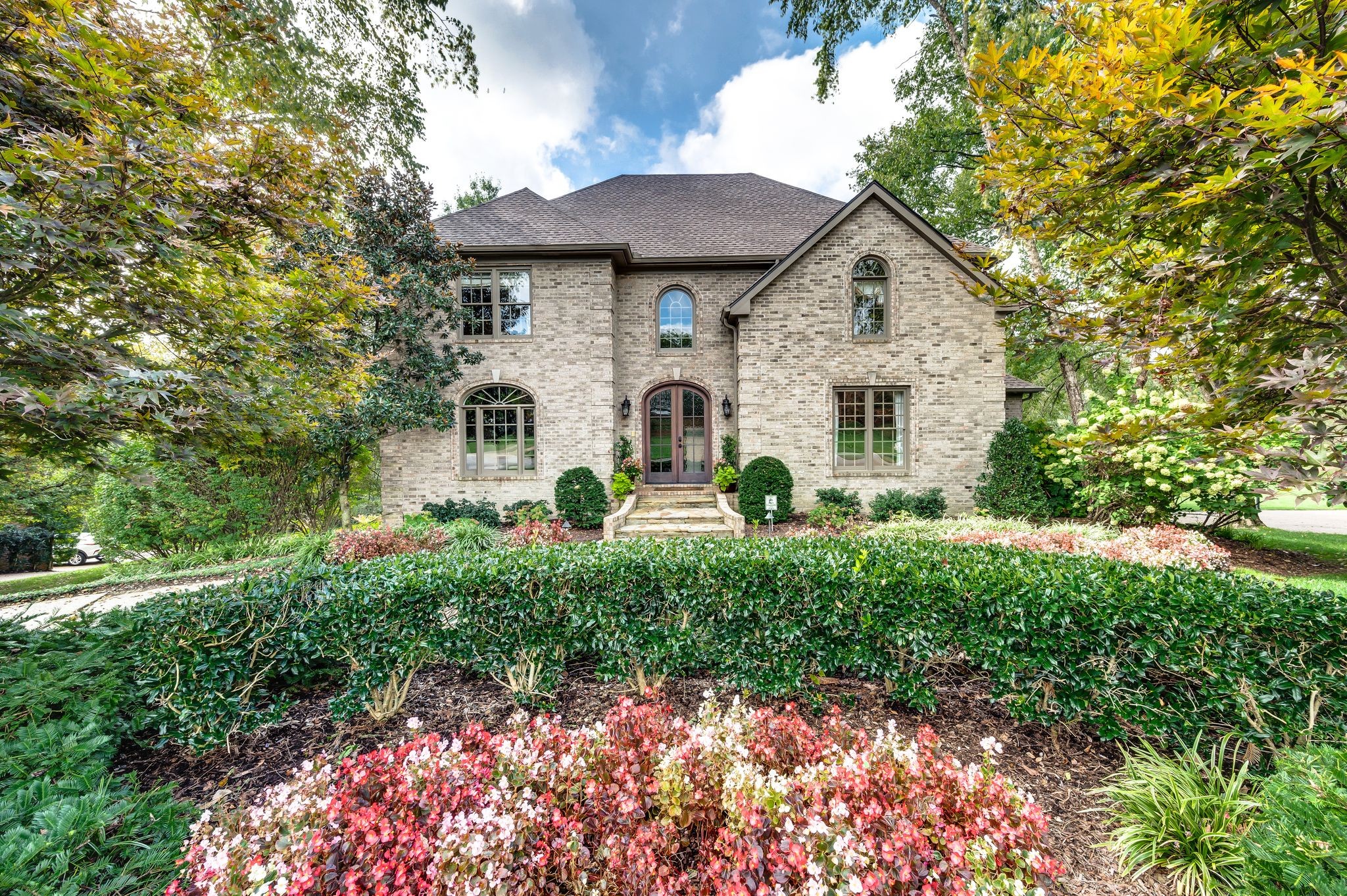 a front view of a house with a yard