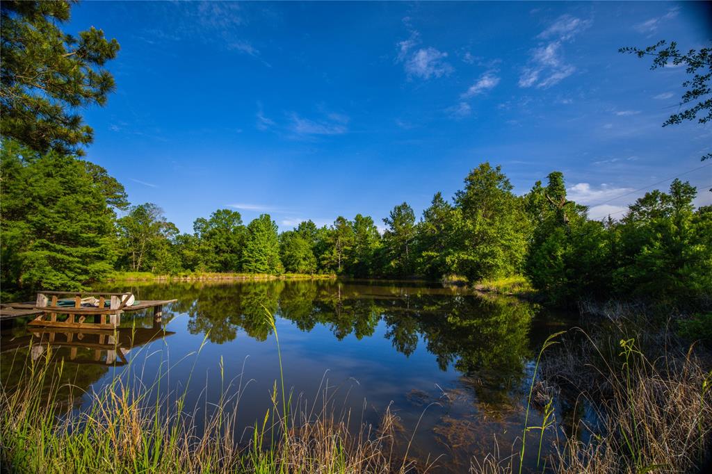 a view of a lake with a house in background