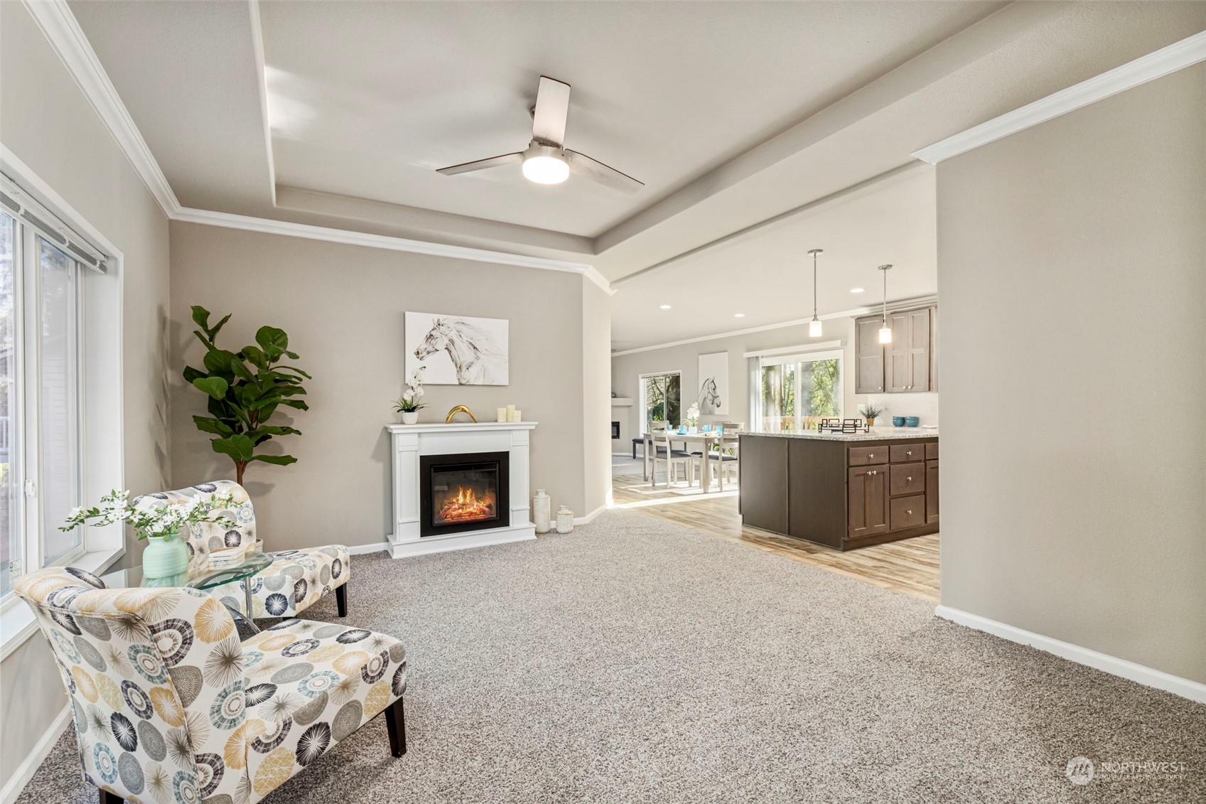 a living room with furniture and a fireplace