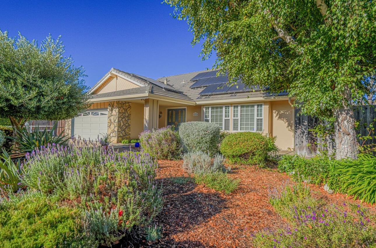 a front view of a house with garden