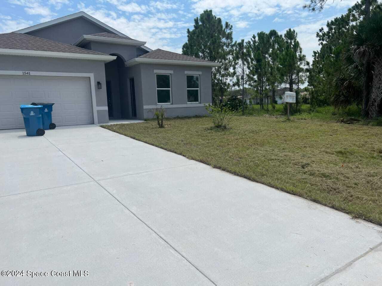 a house with trees in the background