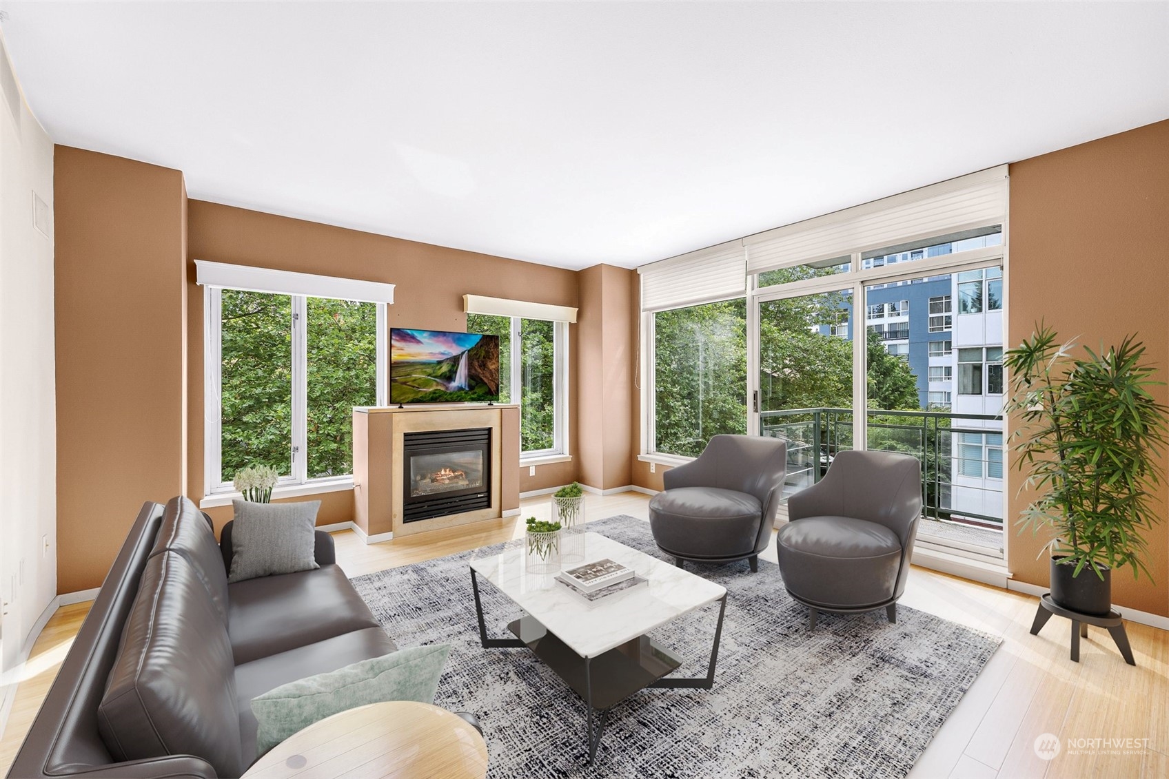 a living room with furniture large window and a fireplace