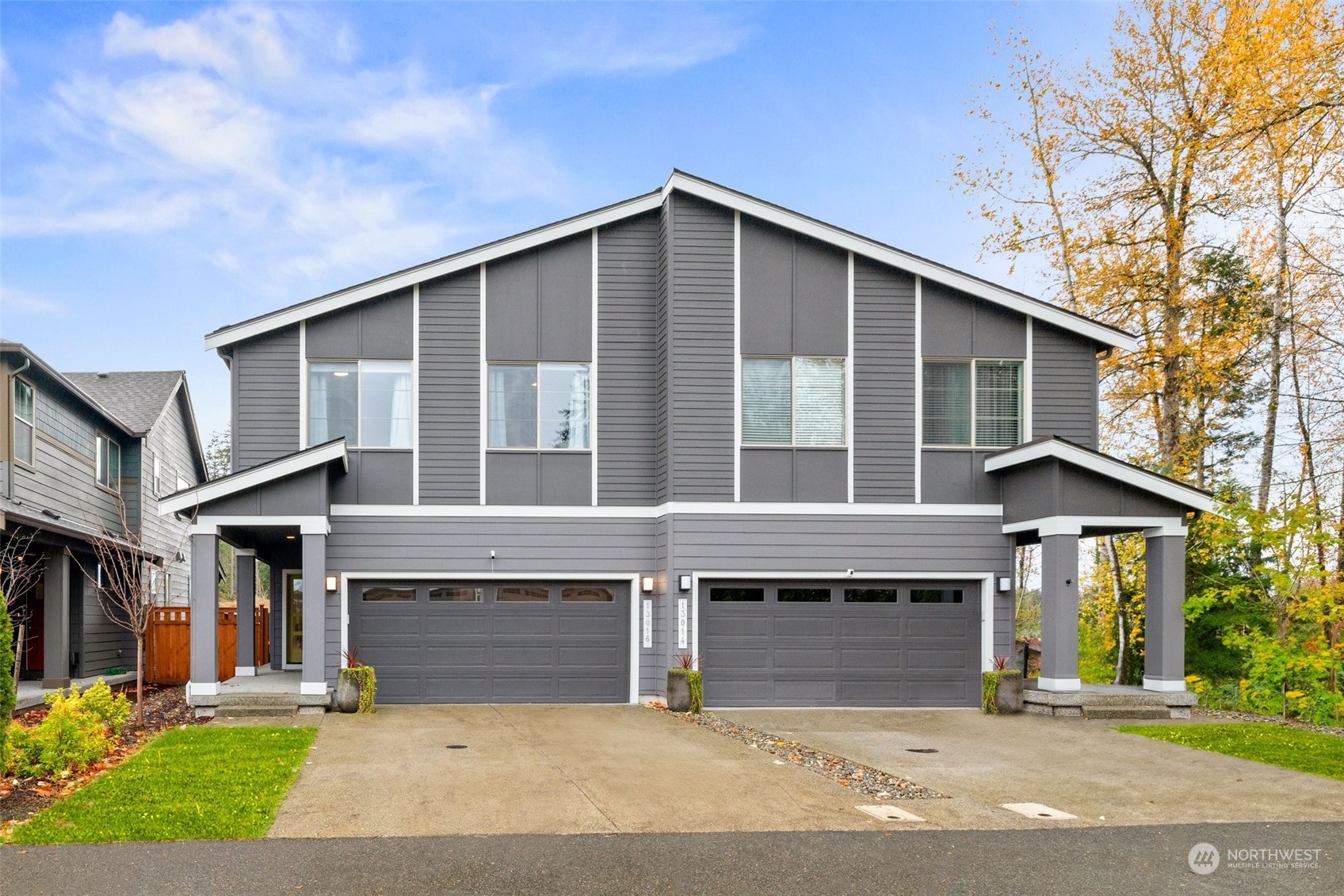 a front view of a house with garage