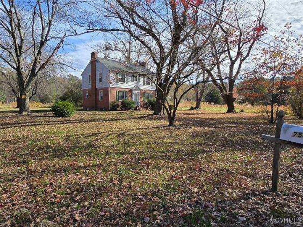 a view of a yard with a tree