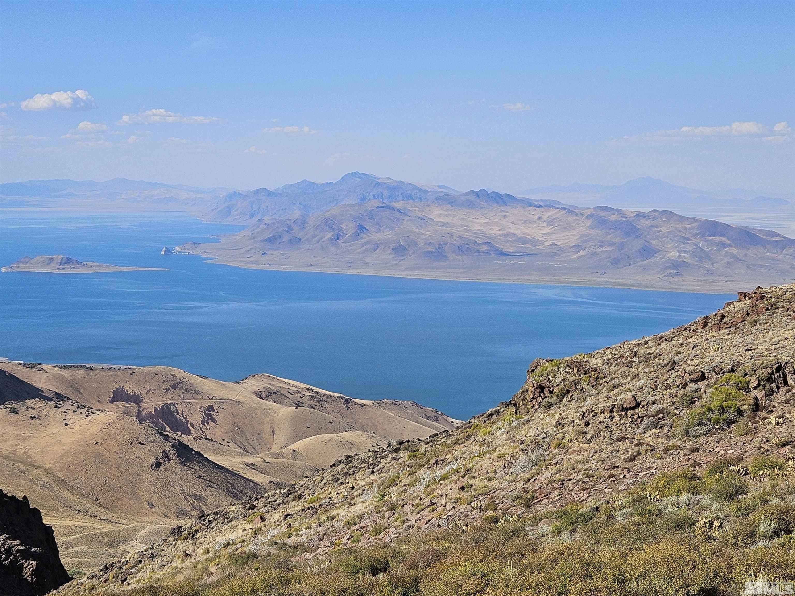 a view of mountain with lake view