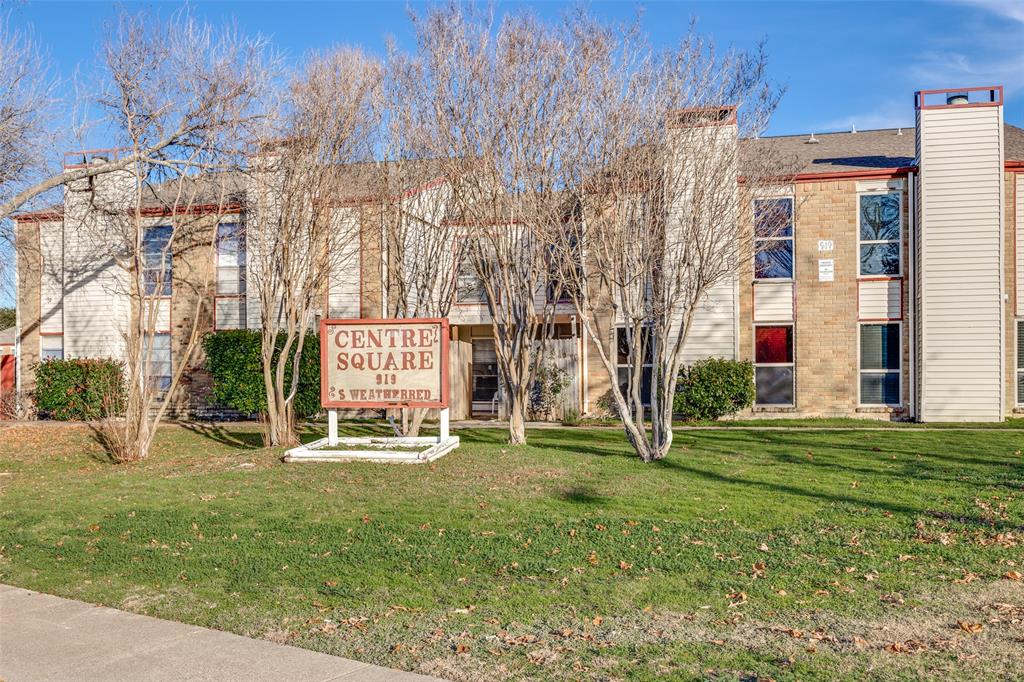 a building with trees in front of it