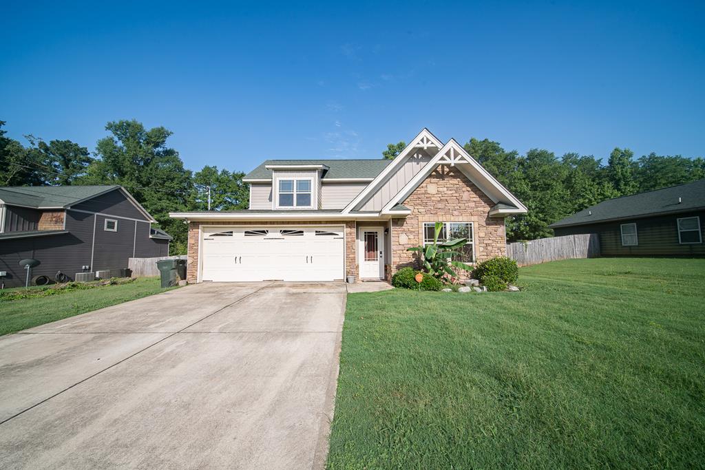 a front view of a house with a yard