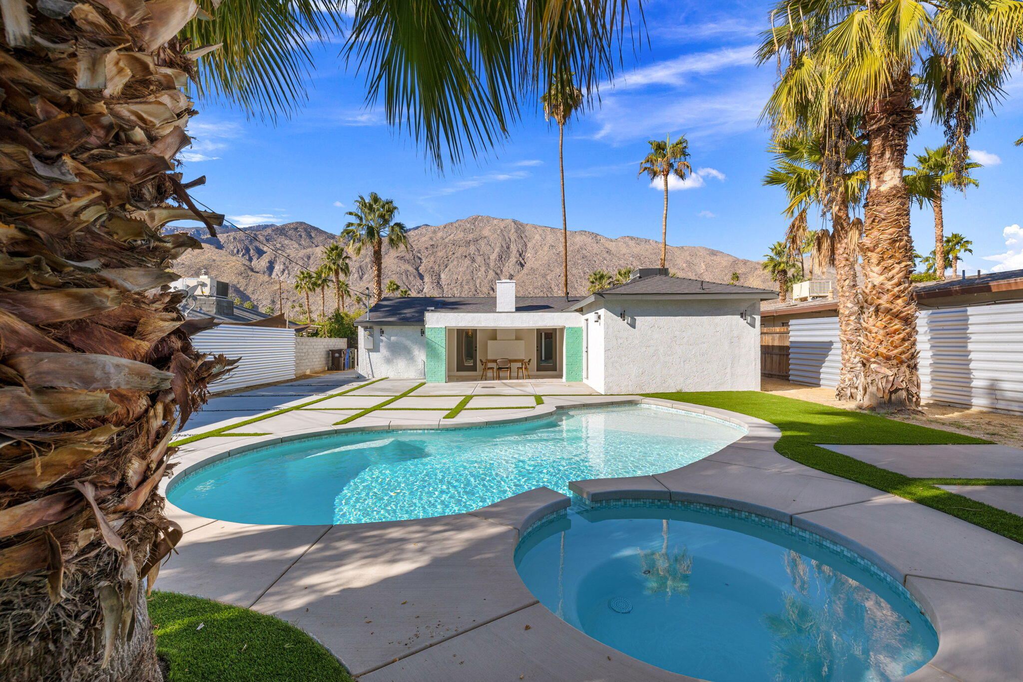 a view of a swimming pool with a yard