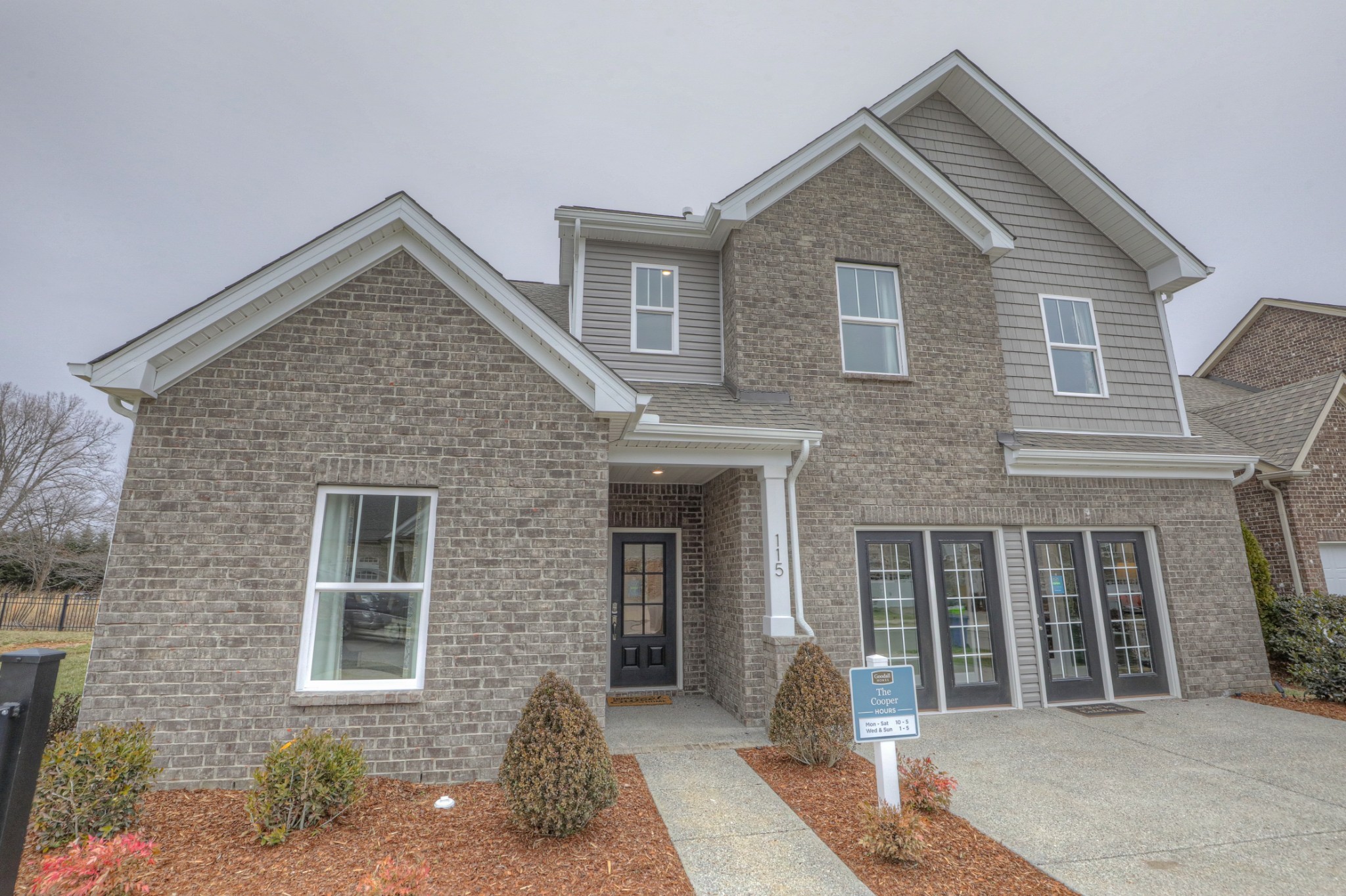 a front view of a house with a yard