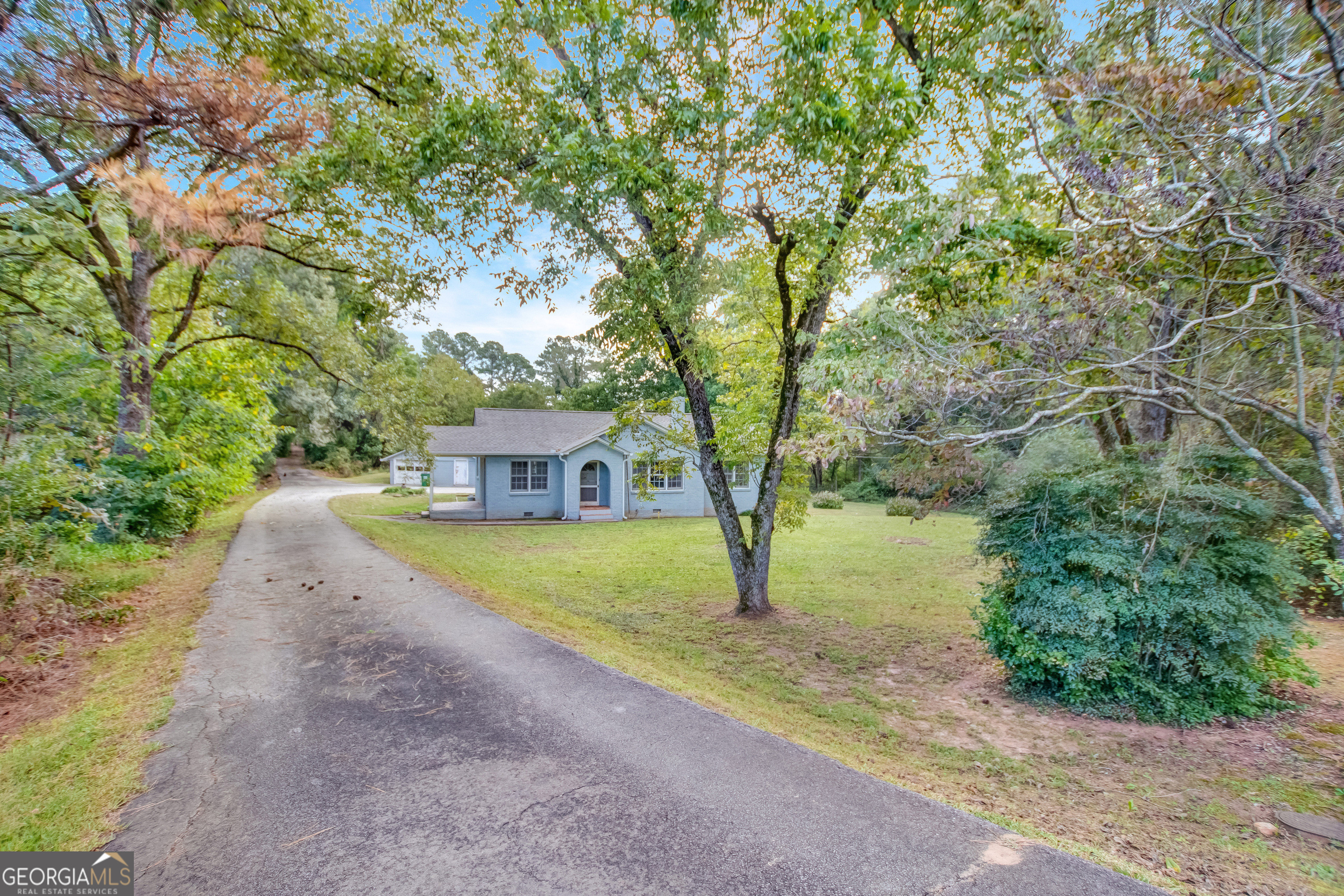 a house with trees in front of it