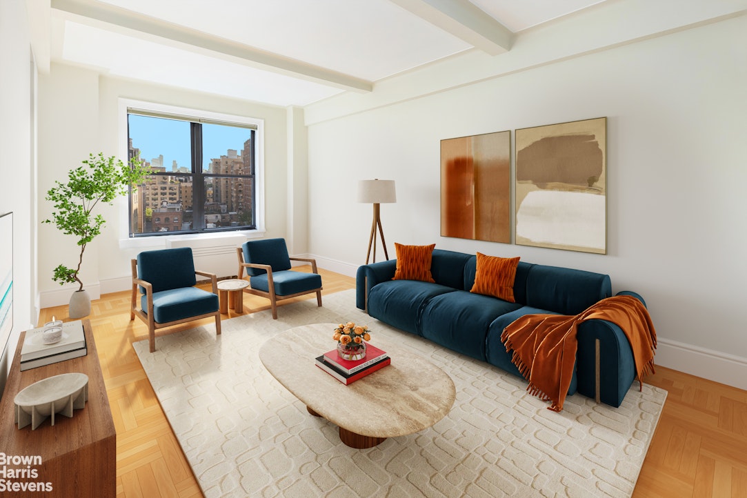 a living room with furniture and a potted plant