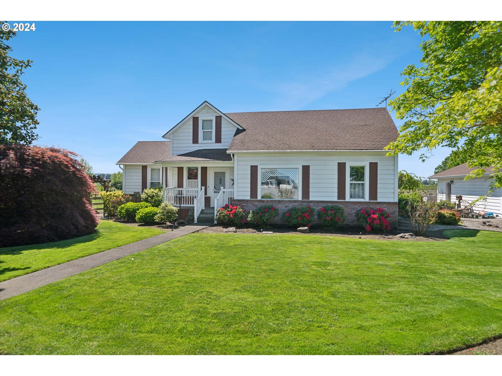 a front view of a house with a yard