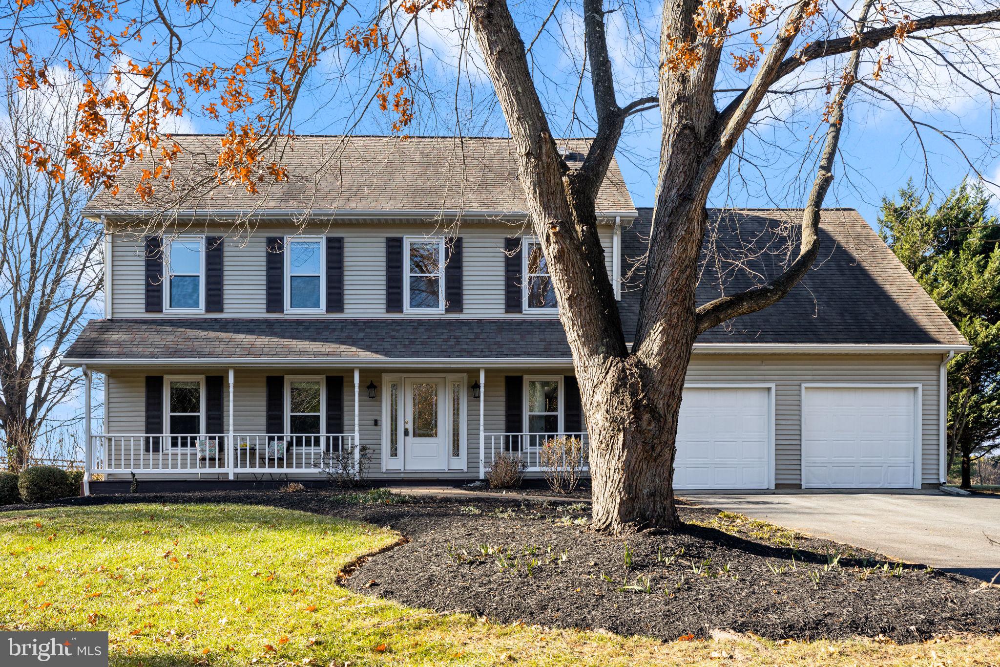 a front view of a house with yard