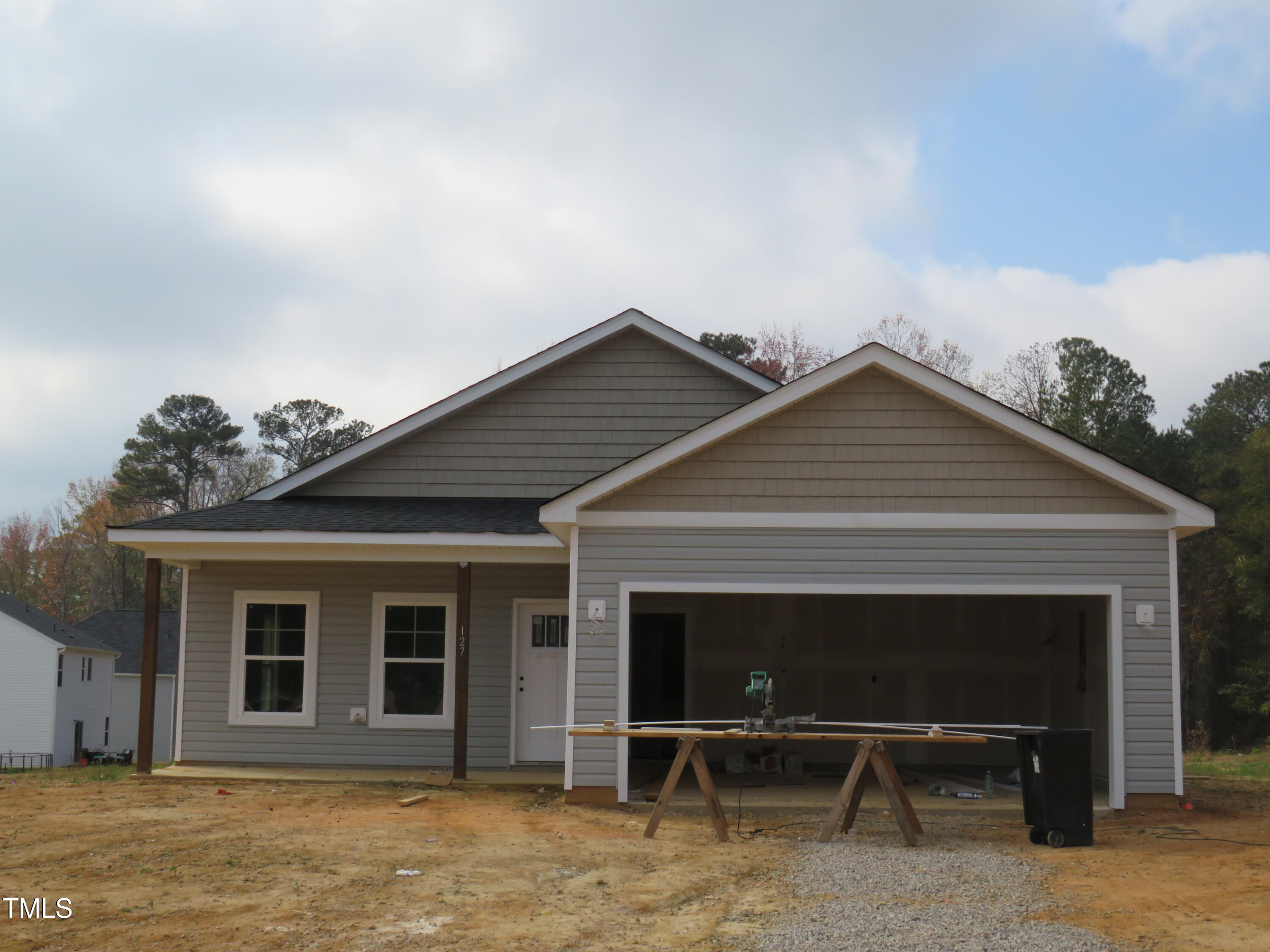 a front view of a house with a garage