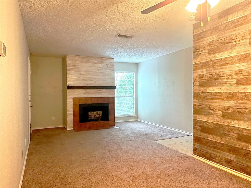 a view of a livingroom with a fireplace