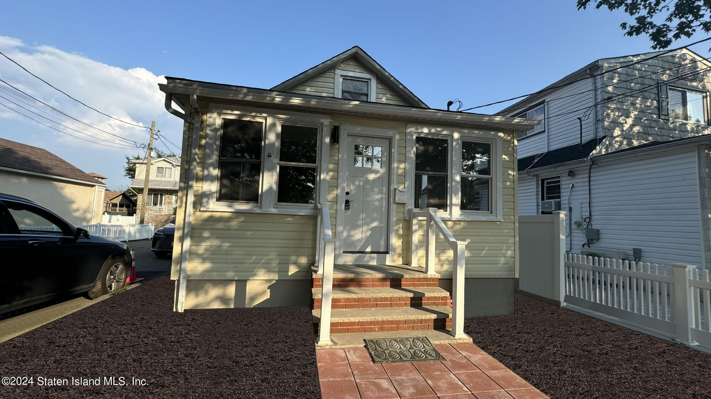 a front view of a house with a porch