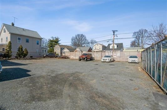 a view of a car park in front of house