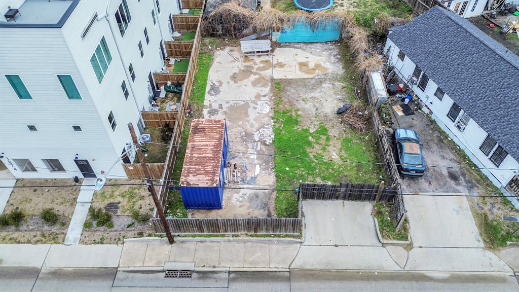 an aerial view of houses with outdoor space