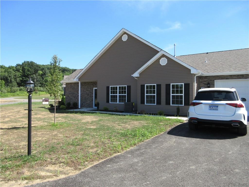 a front view of a house with a yard