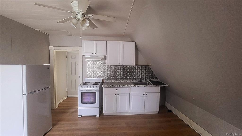 a kitchen with a refrigerator a sink and dishwasher