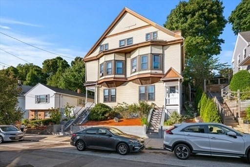 a car parked in front of a house