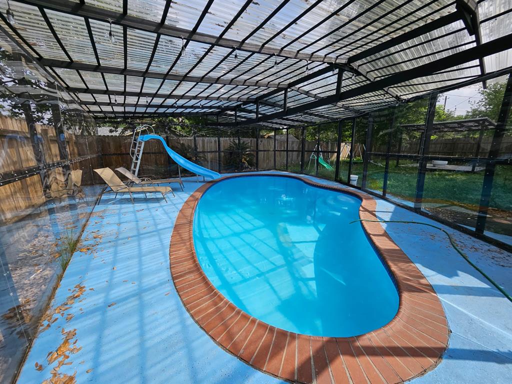 a view of a swimming pool with a patio