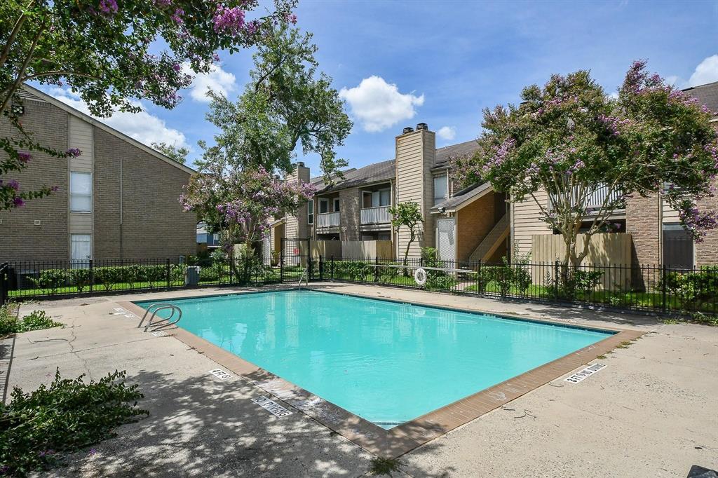 a house with swimming pool in front of it