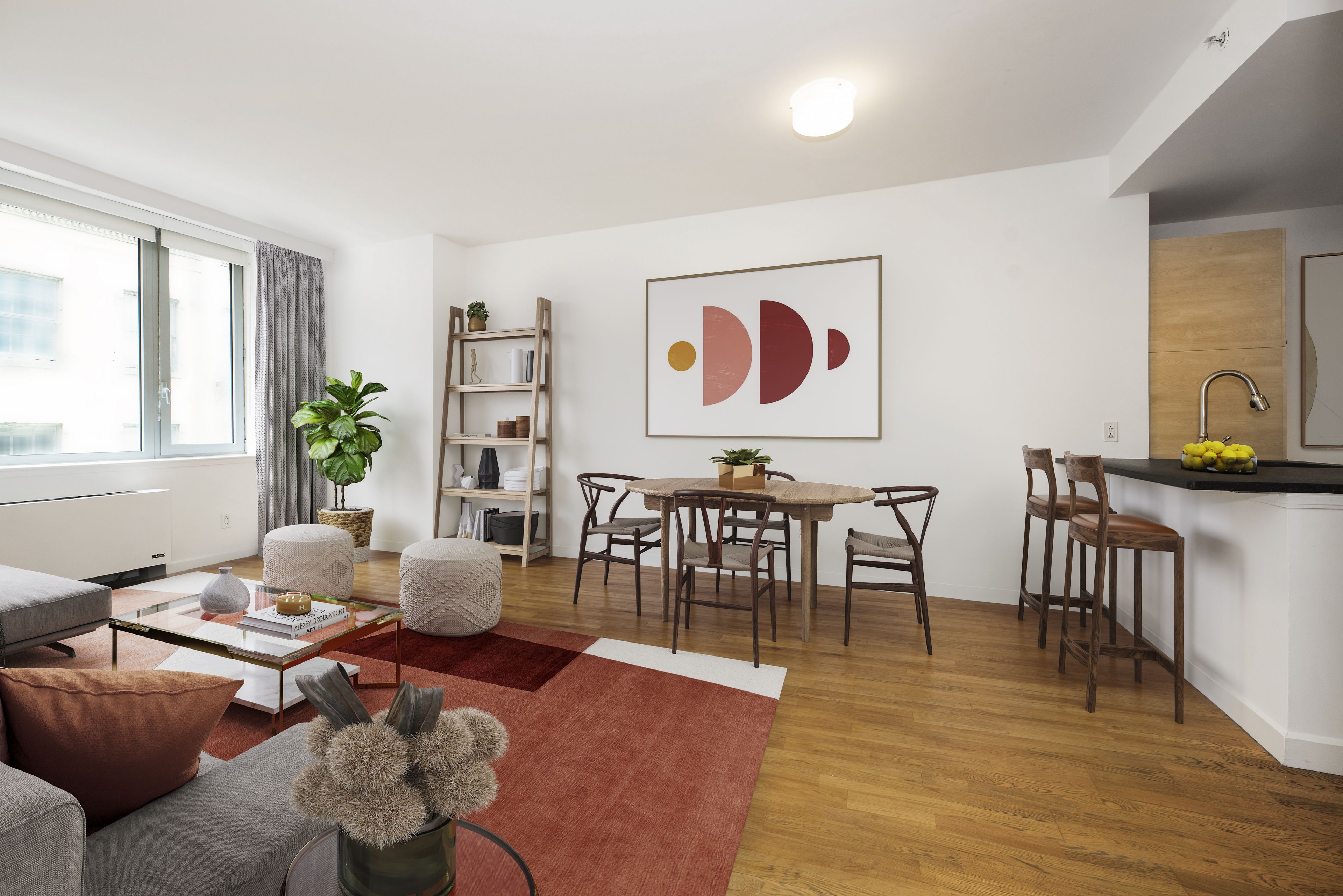 a living room with furniture and wooden floor