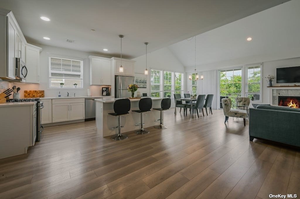 a view of living room kitchen with furniture and flat screen tv